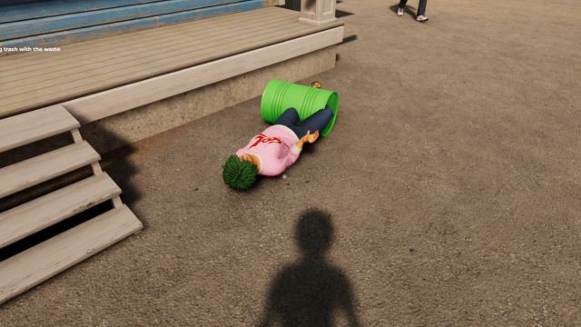 A customer on the ground, after being hit with an empty gas barrel in Roadside Research.