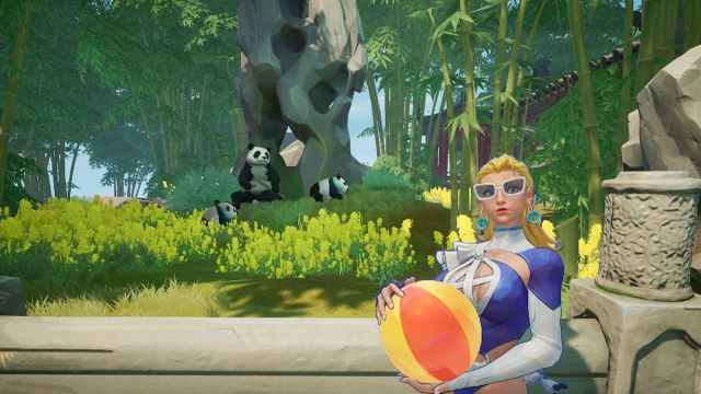 Invisible Woman holding a volleyball while standing in front of pandas in a bamboo forest in marvel rivals